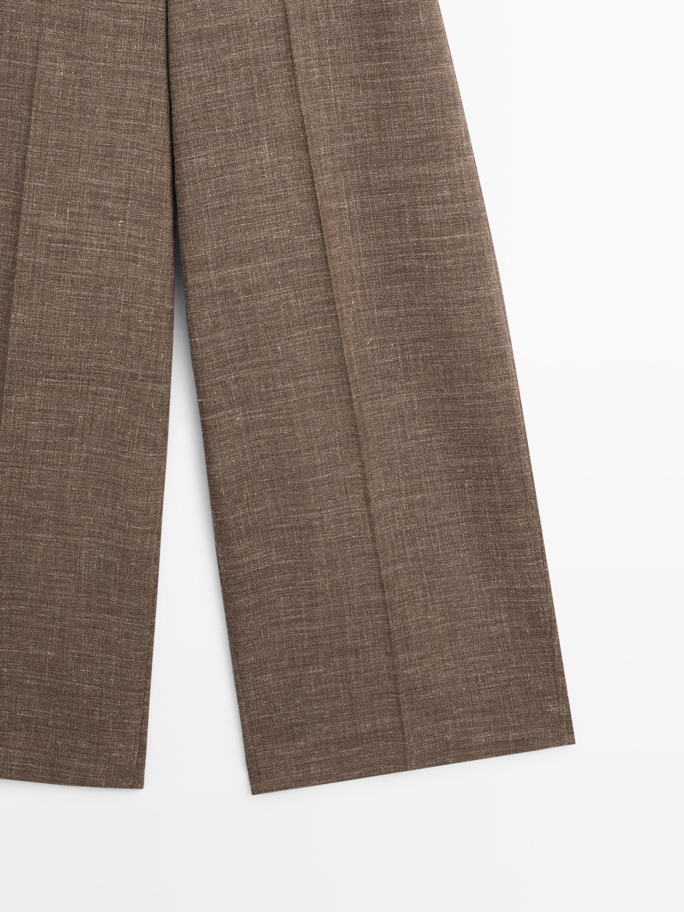 Wide-leg voluminous wool blend trousers